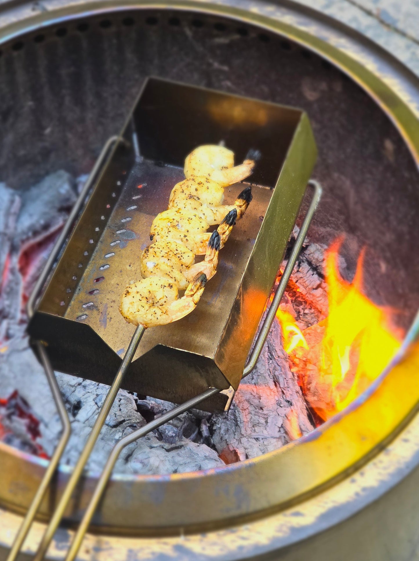 The roaster is cooking shrimp, showing the wide range of different foods that can be cooked.