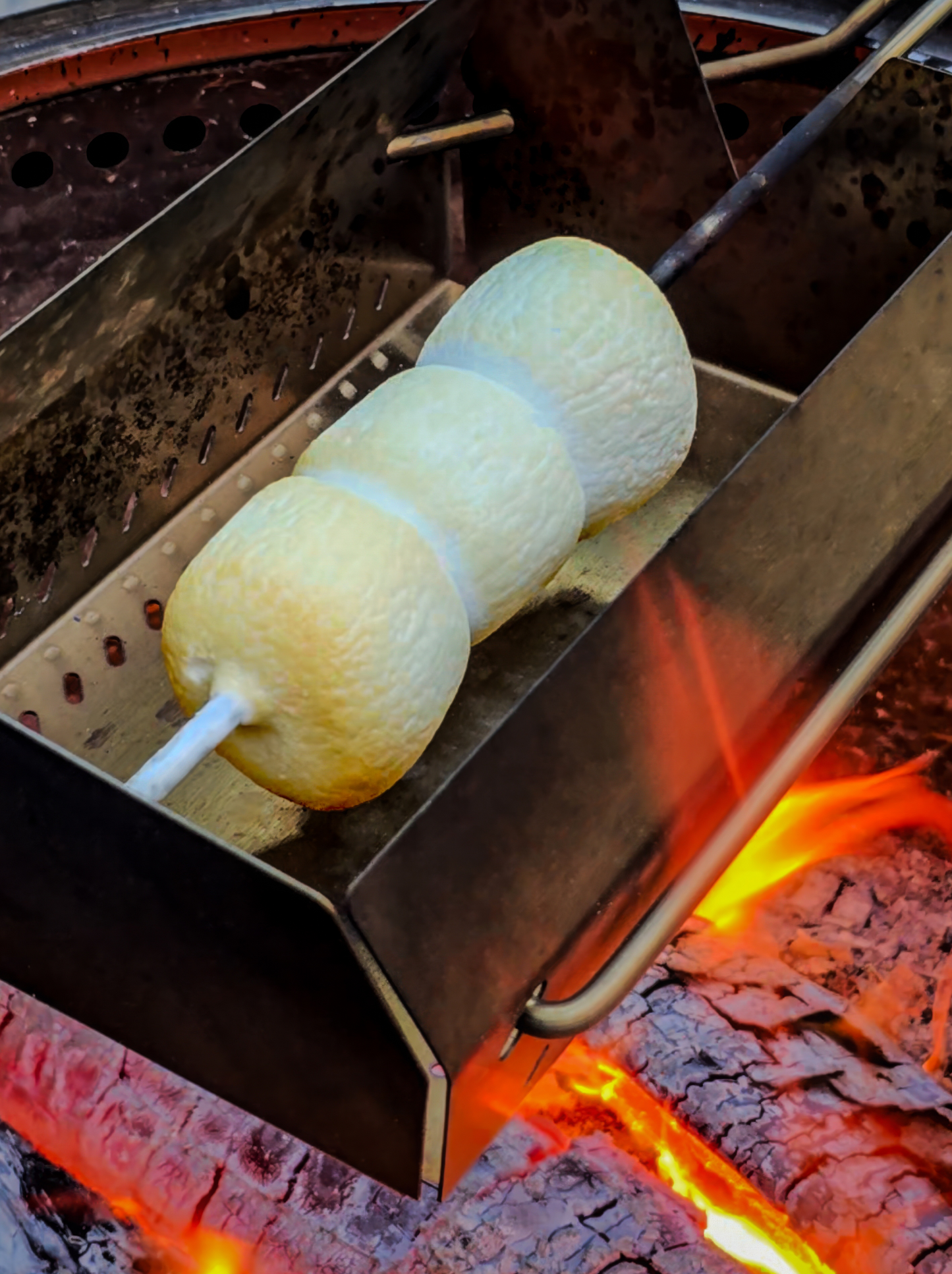 The best marshmallows ever. Perfectly golden brown, fully cooked, and gooey in the center. Used for the best s'more ever.